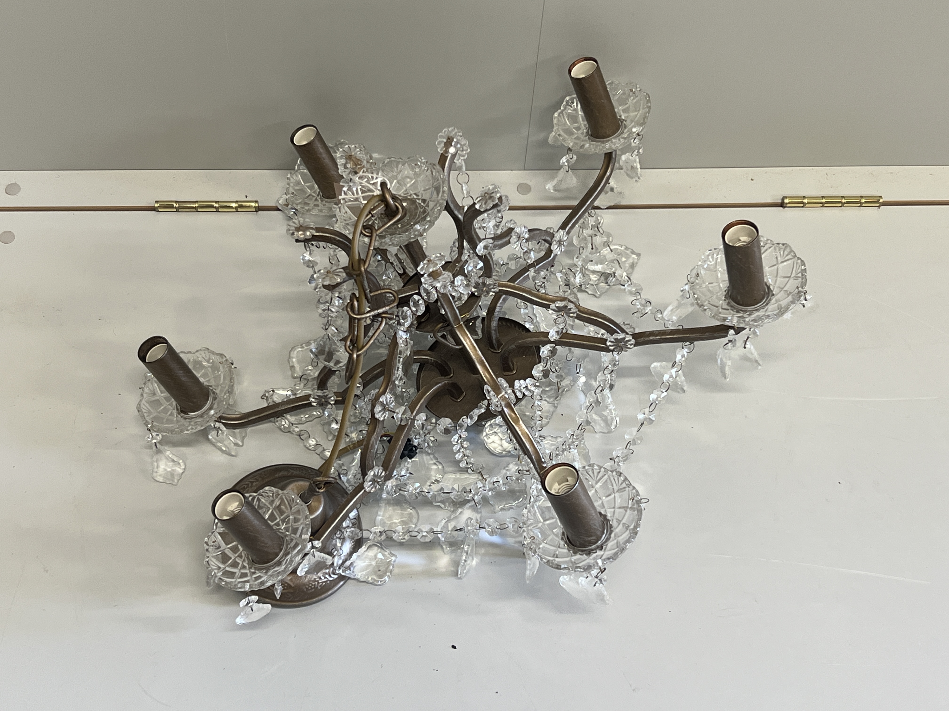 A six branch cut glass chandelier, diameter 68cm